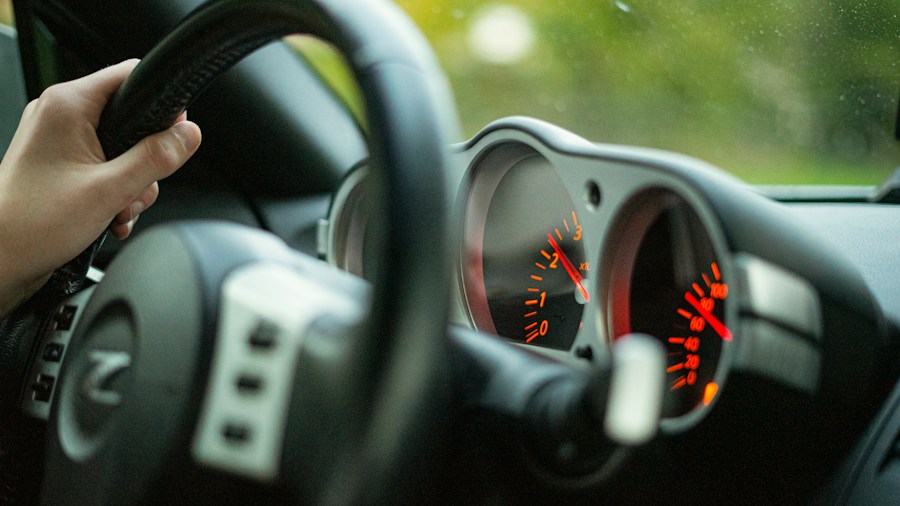 Last Chevrolet Corvette C7 Front Engine Model: What Buyers Should Know Before Buying 1 driver hands steering wheel fast car