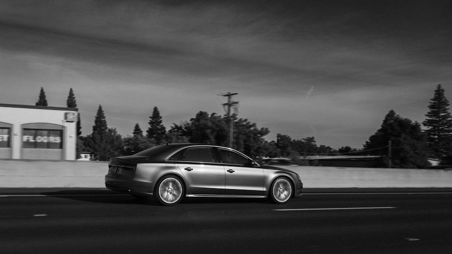 high performance sedan driving highway