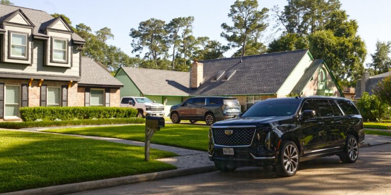hybrid SUV charging modern driveway