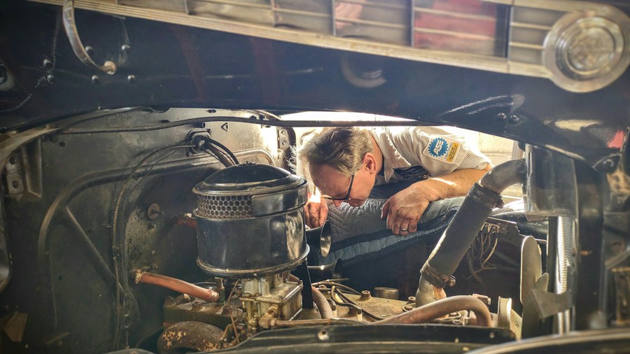 mechanic checking truck coolant level