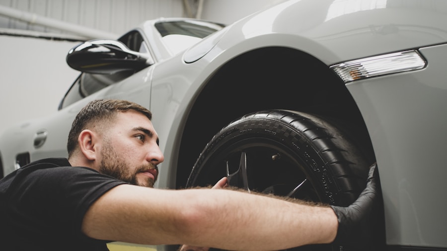 mechanic installing tires on vehicle