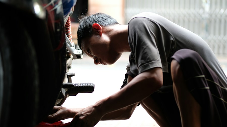 TPMS Technology Update: What Tire Shoppers Need to Know About Faster Service 1 mechanic programming tire sensor