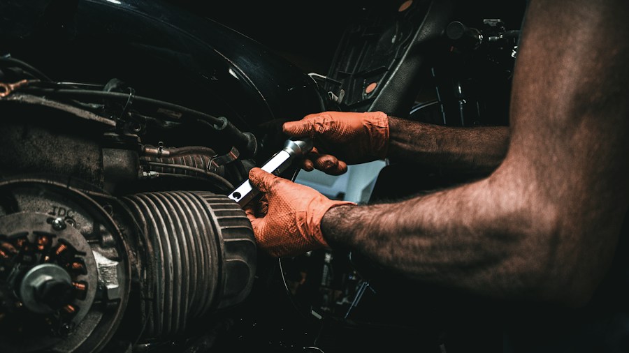 Silverado and Colorado Owners Report Factory Oil Leak Issue What Buyers Should Know 1 mechanic tightening oil filter