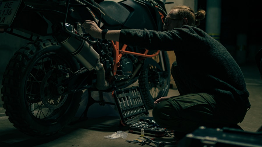 motorcycle mechanic working on engine