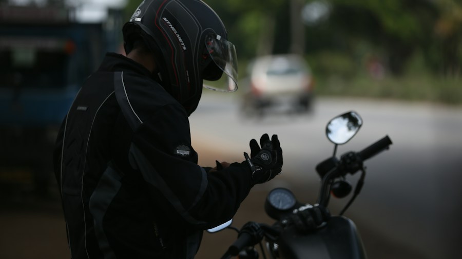 motorcycle rider checking phone connectivity notification