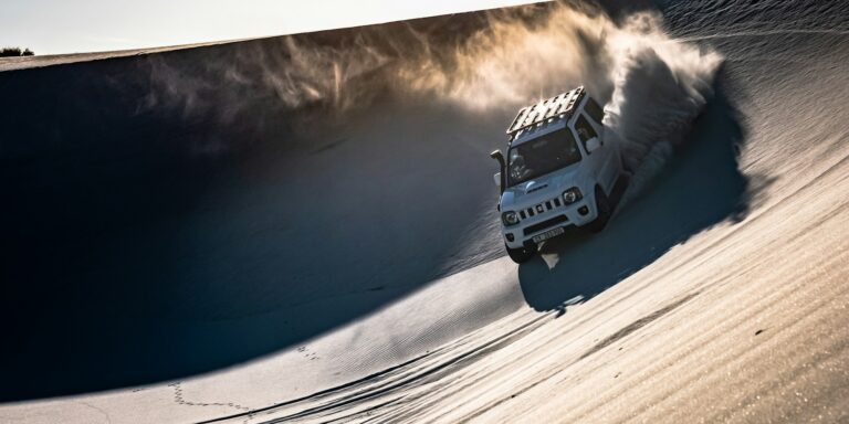 performance truck driving desert sand