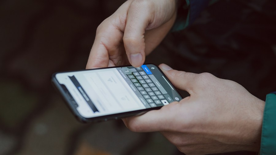 Tesla Grok Bot Now Offers In-Vehicle Banking: What Buyers Need to Know 1 person checking financial accounts on phone