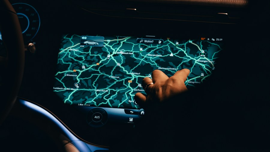 person using car touchscreen display