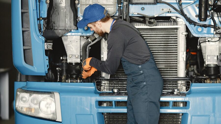 Klein Tools Launches New 2-in-1 Adjustable Wrench with Pass-Thru Ratchet Feature 2 professional technician working in tight engine space