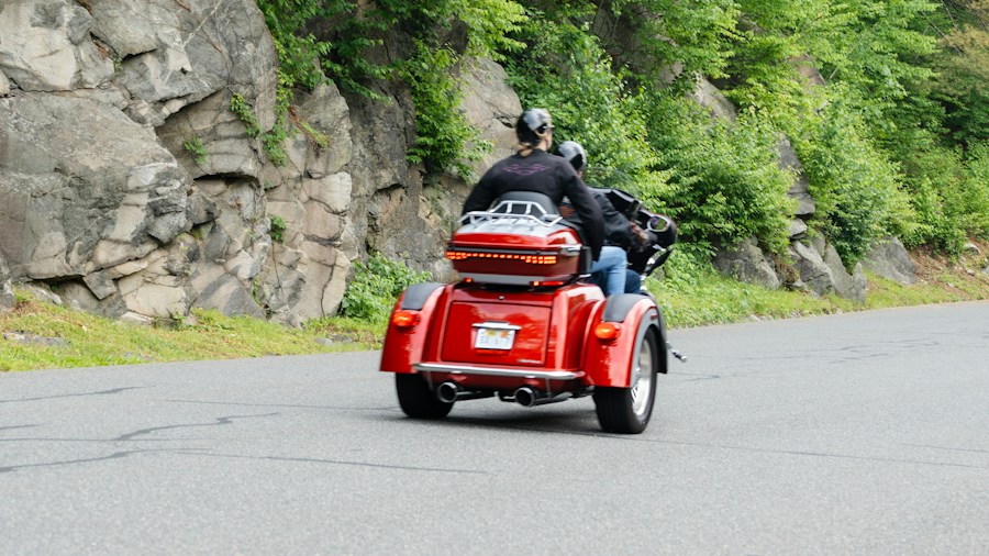 three wheeled motorcycle enthusiast passengers