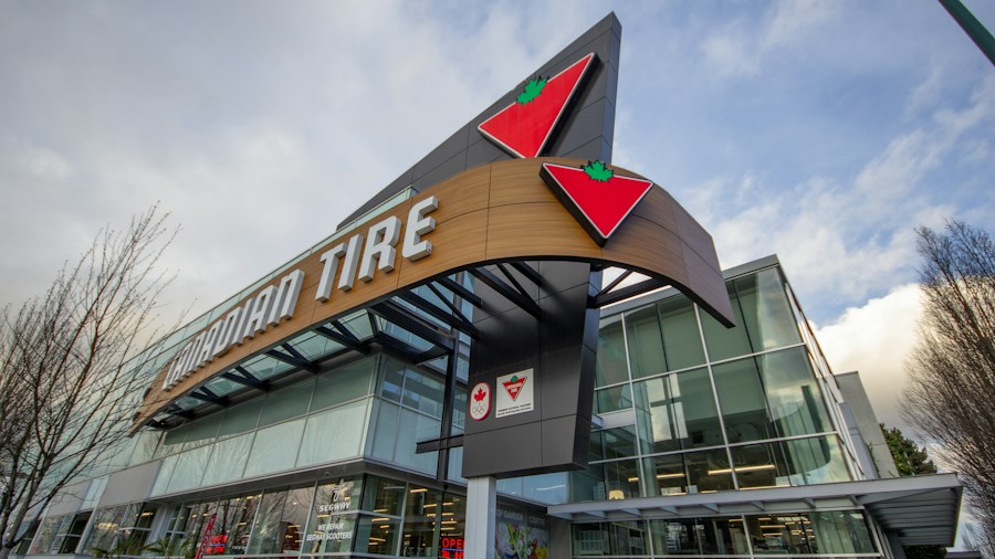 tire store staff helping customer